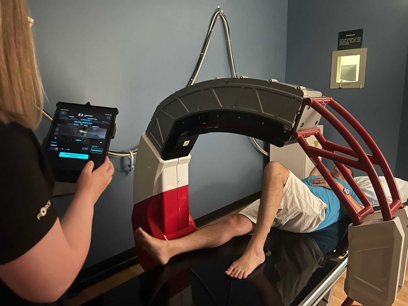 A technologist at Access Sports Medicine uses the interface to prepare a patient for a scan, which lasts a few seconds